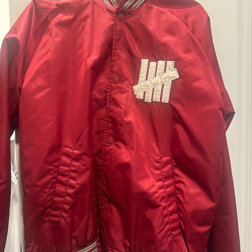 Undefeated Red Puffer Jacket Vibrant Bold Design